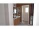 Bathroom featuring a double vanity with wood cabinets, mirror, and tile floors at 1015 S Val Vista Dr # 8, Mesa, AZ 85204
