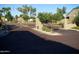 Community entry gate with brick-paved road and lush desert landscaping at 1015 S Val Vista Dr # 8, Mesa, AZ 85204