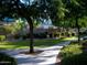Well-maintained grounds with lush lawn, trees, bushes and a sidewalk at 1015 S Val Vista Dr # 8, Mesa, AZ 85204