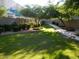 Well-maintained grounds with lush lawn, trees, bushes and a sidewalk at 1015 S Val Vista Dr # 8, Mesa, AZ 85204