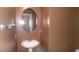 Half bath features pedestal sink and oval mirror at 1015 S Val Vista Dr # 8, Mesa, AZ 85204