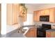 Well-lit kitchen with dark appliances and light cabinets at 1015 S Val Vista Dr # 8, Mesa, AZ 85204