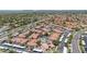 Scenic aerial view of neighborhood featuring a pool, landscaping, and covered parking at 11375 E Sahuaro Dr # 1008, Scottsdale, AZ 85259