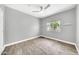Bedroom featuring wood-look tile floors, a ceiling fan, and a window view of the outdoors at 11375 E Sahuaro Dr # 1008, Scottsdale, AZ 85259