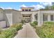 Apartment community entrance with manicured desert landscaping along sidewalk at 11375 E Sahuaro Dr # 1008, Scottsdale, AZ 85259