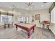 Relaxing game room with a pool table, ceiling fan, and natural light at 11375 E Sahuaro Dr # 1008, Scottsdale, AZ 85259