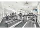 Community gym featuring cardio equipment, weights, and mirrored wall at 11375 E Sahuaro Dr # 1008, Scottsdale, AZ 85259