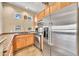Charming kitchen with stainless steel appliances and breakfast bar at 11375 E Sahuaro Dr # 1008, Scottsdale, AZ 85259