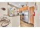 Open kitchen featuring stainless steel appliances and breakfast bar seating at 11375 E Sahuaro Dr # 1008, Scottsdale, AZ 85259