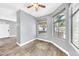 Bright living room with windows and ceiling fan at 11375 E Sahuaro Dr # 1008, Scottsdale, AZ 85259
