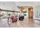 Bright living area featuring a cozy fireplace, comfortable seating, and lots of natural light at 11375 E Sahuaro Dr # 1008, Scottsdale, AZ 85259