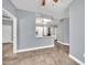 Open concept floorplan showing the kitchen and living room with wood-look tile flooring at 11375 E Sahuaro Dr # 1008, Scottsdale, AZ 85259