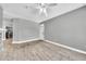 Open-concept living room features stylish wood-look tile flooring and neutral paint, creating a modern and inviting space at 11375 E Sahuaro Dr # 1008, Scottsdale, AZ 85259
