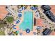 Aerial view of a vibrant pool surrounded by lounge chairs and manicured landscaping at 11375 E Sahuaro Dr # 1008, Scottsdale, AZ 85259
