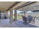 Outdoor patio with seating area, overhead string lights, grill, and view of the yard at 12029 N 44Th Dr, Glendale, AZ 85304