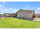 A well-maintained backyard showcasing a lush lawn, covered patio, and mature landscaping offering privacy and space at 12029 N 44Th Dr, Glendale, AZ 85304