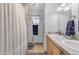 Well-lit bathroom featuring double sinks, shower and neutral color palette at 12029 N 44Th Dr, Glendale, AZ 85304
