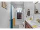 Cozy bathroom featuring a white sink, colorful shower curtain, and neutral tones at 12029 N 44Th Dr, Glendale, AZ 85304