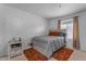 Comfortable bedroom featuring carpet, natural light, and a contemporary bed frame at 12029 N 44Th Dr, Glendale, AZ 85304