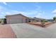 Charming single-story home featuring a two-car garage and low-maintenance desert landscaping at 12029 N 44Th Dr, Glendale, AZ 85304
