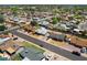 This home features a well-maintained front yard, a two car garage, and mature trees at 1407 W Chilton St, Chandler, AZ 85224