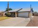 Charming single-story home with a two-car garage and well-maintained front yard at 1407 W Chilton St, Chandler, AZ 85224