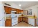 Kitchen with wood cabinets, and modern appliances at 1407 W Chilton St, Chandler, AZ 85224