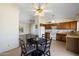 Bright kitchen with dining area, featuring wood cabinets at 1407 W Chilton St, Chandler, AZ 85224