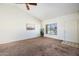Living room with a bright window and neutral carpet at 1407 W Chilton St, Chandler, AZ 85224