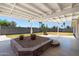 This home features a large patio with a custom brick garden bed and a wide covered seating area at 1407 W Chilton St, Chandler, AZ 85224