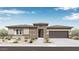 Charming single-story home with desert landscaping, brick accents, and a two-car garage at 14187 W Soft Wind Cir, Surprise, AZ 85387