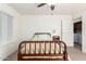 Bedroom featuring light-filled windows and access to the laundry room at 14300 W Bell Rd # 6, Surprise, AZ 85374