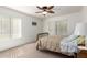 Cozy bedroom featuring a ceiling fan, and a light-filled window at 14300 W Bell Rd # 6, Surprise, AZ 85374
