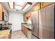 Well-equipped kitchen with stainless steel appliances, granite counters, and wood cabinetry at 14300 W Bell Rd # 6, Surprise, AZ 85374