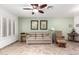 Cozy living area with tile flooring, neutral paint and plantation shutters at 14300 W Bell Rd # 6, Surprise, AZ 85374
