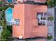 Aerial view of a beautiful home showcasing the backyard pool, patio, and lush landscaping at 16238 N 58Th St, Scottsdale, AZ 85254