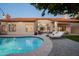 A backyard oasis featuring a refreshing pool and patio area, perfect for outdoor relaxation and entertaining at 16238 N 58Th St, Scottsdale, AZ 85254