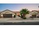 Charming single-story home featuring a tile roof, desert landscaping, and a two-car garage at 16238 N 58Th St, Scottsdale, AZ 85254