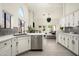 Bright, modern kitchen with stainless steel appliances and seamlessly flowing into the living space at 16238 N 58Th St, Scottsdale, AZ 85254