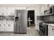 Well-appointed kitchen offers stainless steel appliances, white cabinetry, and sleek countertops at 16238 N 58Th St, Scottsdale, AZ 85254