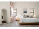 Inviting main bedroom with light curtains, platform bed, and modern decor accents at 16238 N 58Th St, Scottsdale, AZ 85254
