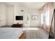 Bright primary bedroom featuring vaulted ceilings, contemporary decor, and views to the bathroom at 16238 N 58Th St, Scottsdale, AZ 85254