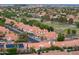 An aerial shot showing houses with well-manicured lawns, mature trees, and community features at 16238 N 58Th St, Scottsdale, AZ 85254