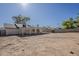 Spacious backyard with a covered patio perfect for outdoor entertaining, awaiting landscaping to personalize the space at 16421 N 34Th Ave, Phoenix, AZ 85053