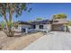 Ranch style home featuring a long driveway and covered parking at 16421 N 34Th Ave, Phoenix, AZ 85053