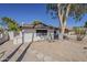 Side view of a home with a brick facade and a well-kept yard at 16421 N 34Th Ave, Phoenix, AZ 85053