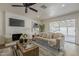 Comfortable living room with fireplace, modern décor, and natural light from sliding glass doors at 16421 N 34Th Ave, Phoenix, AZ 85053