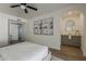 Main bedroom with neutral decor, artwork, and ensuite bathroom featuring a modern vanity and mirror at 16421 N 34Th Ave, Phoenix, AZ 85053