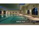 Bright, clean indoor lap pool with multiple lanes, and seating at 16578 W Mulberry Dr, Goodyear, AZ 85395