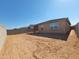 Spacious dirt backyard enclosed by block wall fencing, ready for landscaping at 19406 N Fiano Dr, Maricopa, AZ 85138